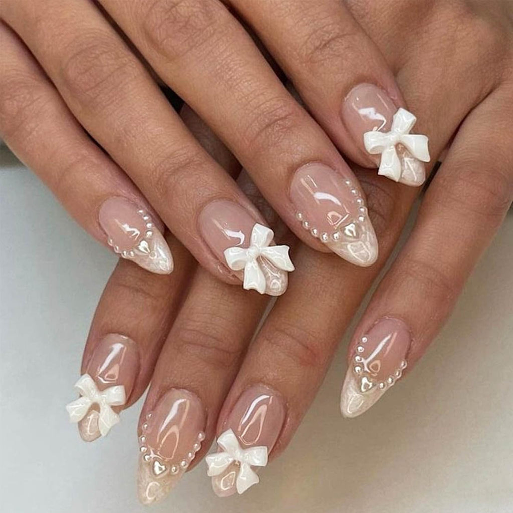 24Pcs Almond Shaped Artificial Nails - French Tips with Cute Bow Charms Design - Nude Pink Acrylic Nails for Women & Girls